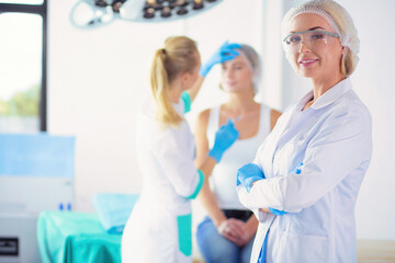 Fototapeta premium Medical equipment: blue stethoscope and tablet on white background. Medical equipment