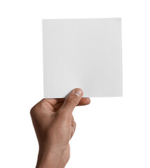 Fototapeta premium Man holding sheet of paper on white background, closeup. Mockup for design