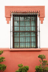 Building with beautiful window and steel grilles