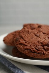 Delicious chocolate chip cookies on plate, closeup