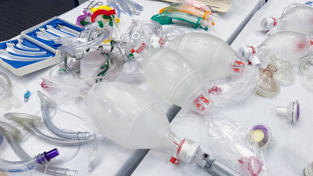 Hospital airway kit signifies emergency airway management. Endotracheal tube, supraglottic airway, laryngoscope, and Ambu bag symbolize crucial interventions for respiratory support