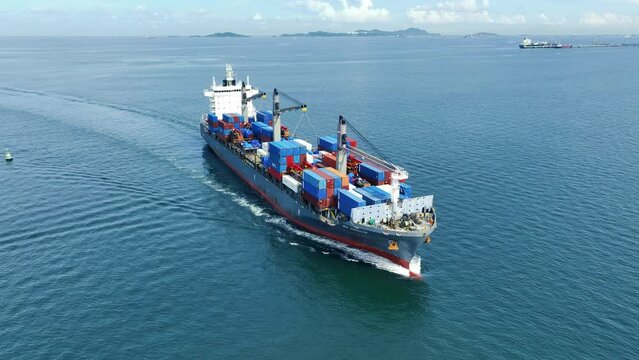 Cargo container Ship, cargo maritime ship with contrail in the ocean ship carrying container and running for export concept technology freight shipping sea freight by Express Ship. front view