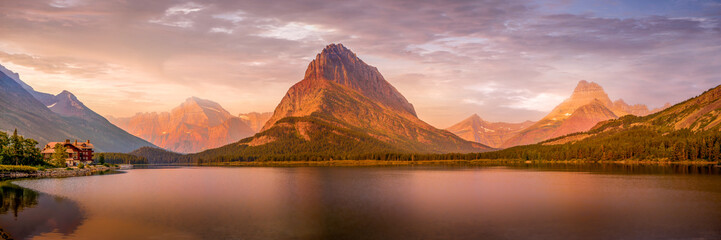 Panorama View of Sunrise over Swiftcurrent Lake and Grinnell Point in Glacier National Park in Montana, USA