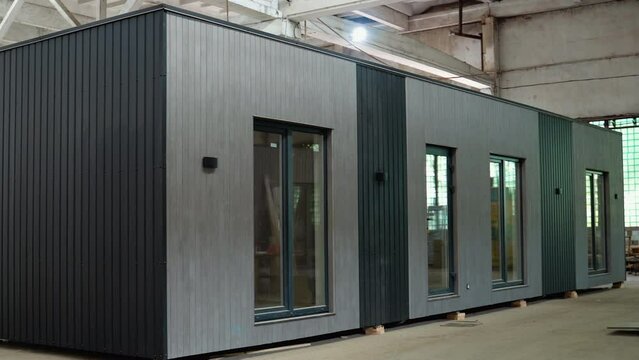 A new modular house for a small office inside an industrial building