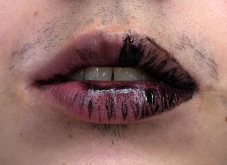 woman with a mustache wearing wiped off black lipstick, open mouth 