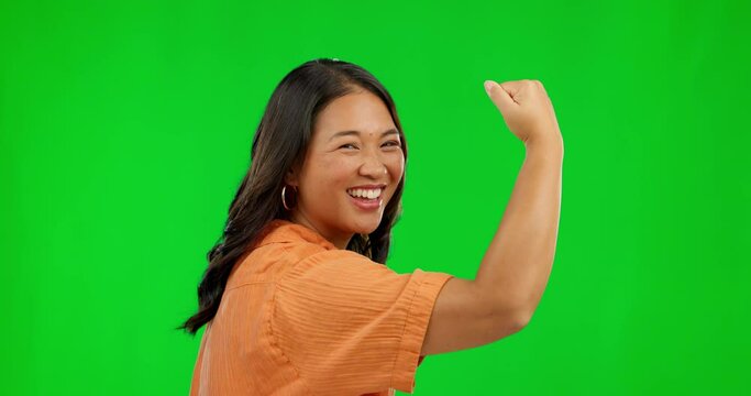 Face, woman and flex arm on green screen in studio isolated on a background. Portrait, strong muscle and Asian person with power, empowerment and pride for strength, gender equality and funny mockup.