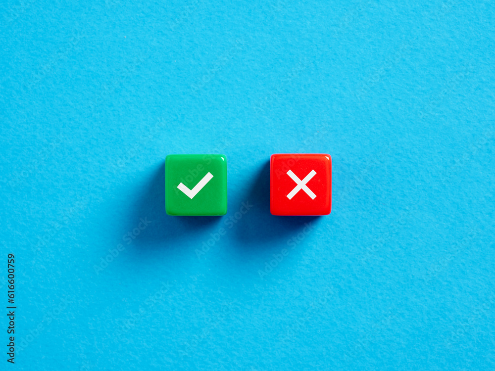 Wall mural right versus wrong. to approve or to reject. decision making concept. checkmark and cross symbols on