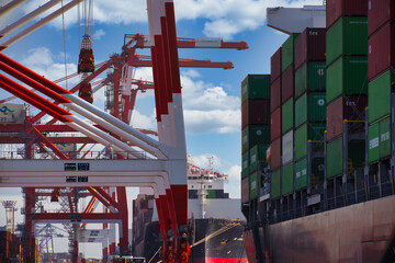 Containers and cranes near the port in Aomi Tokyo telephoto shot