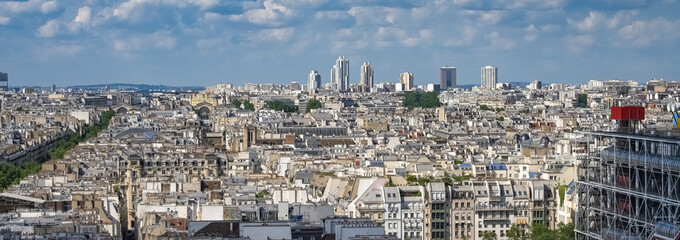 Paris, aerial view of the city, with the Pompidou center, and the Defense in background
