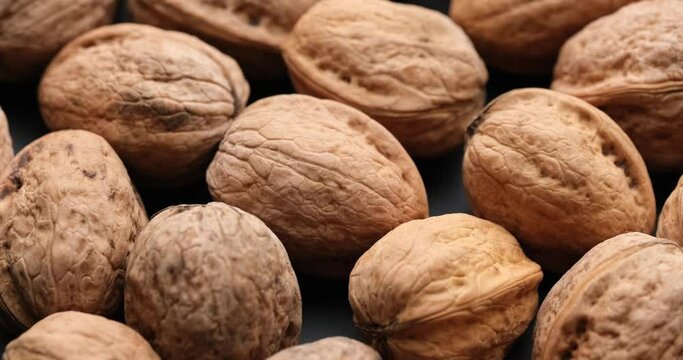 Whole walnuts close-up on sliding platform