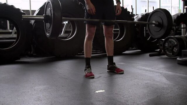 Slow Motion Shot Of Athlete Dropping Barbell While Working Out At Health Club - San Francisco, California