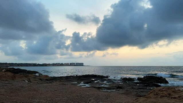 Time lapse sunrise over Punta Prima / Playa Flamenca in Orihuela Costa, Costa Blanca, Spain.