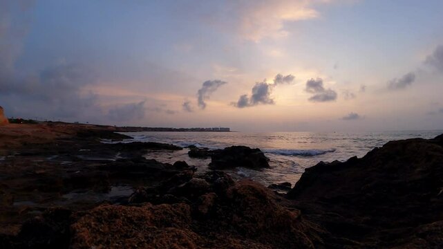 Time lapse sunrise over Punta Prima / Playa Flamenca in Orihuela Costa, Costa Blanca, Spain.