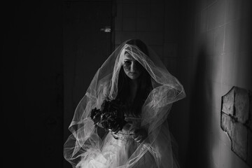 Ghost in haunted house, mysterious woman bride in white dress standing in abandoned building,...