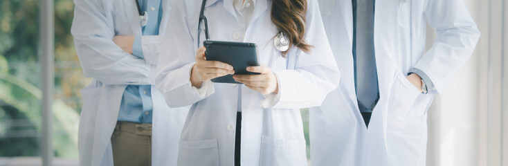 Female Asia doctor using digital tablet