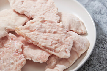 frozen chicken breast on a plate