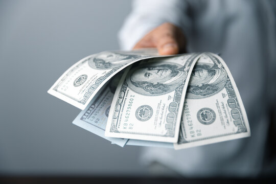 100 dollar cash bill is the biggest note bank. Financial investment success. Currency in America is dollar. Money exchange rate is up and down depend on USD. Wealthy people have a lots of money.