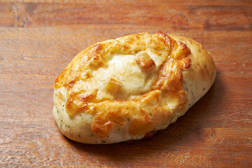 loaf of bread on wooden table