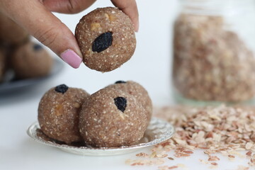 Rajamudi rice flakes laddu. Sweet balls made of roasted rajamudi rice flakes, coconut and jaggery along with cashew and almonds