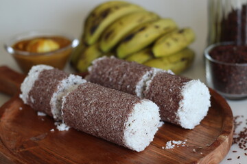 Poongar rice puttu served with spicy egg curry and bananas
