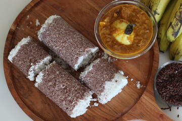 Poongar rice puttu served with spicy egg curry