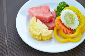 Tropical fruits and vegetables on a plate