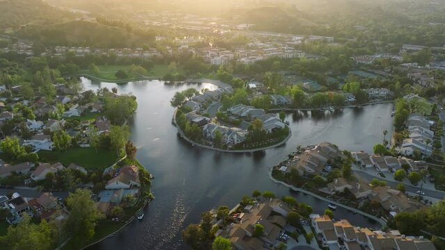Aerial view of rich suburban neighbourhood of Calabasas Lake, Los Angeles county, USA. The most expensive houses and luxury mansions within exclusive gated communities. High quality 4k footage