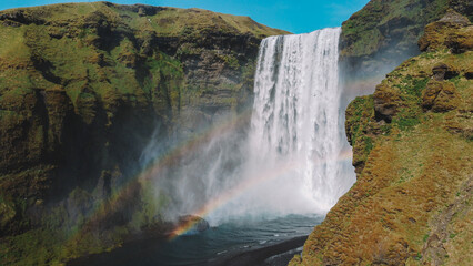 Fototapeta na wymiar Waterfall In Iceland. Amazing View Of The Skogafoss Waterfall