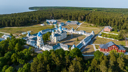 panoramic view of the Valaam skerries and monasteries against the backdrop of blue water and a...
