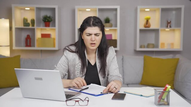 Home office worker woman having a heart attack.