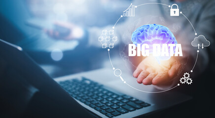 Businessman using laptops and Hand hold brain with Big data, AI big data symbols, Data Management Systems on the computer, Corporate strategy for finance and technology Software development