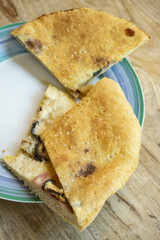 focaccia stuffed with ham, mushrooms and cheese