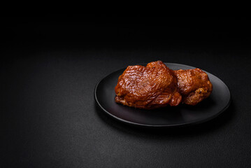 Delicious fried or smoked chicken thighs grilled with spices and herbs