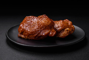 Delicious fried or smoked chicken thighs grilled with spices and herbs