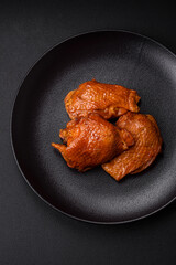 Delicious fried or smoked chicken thighs grilled with spices and herbs