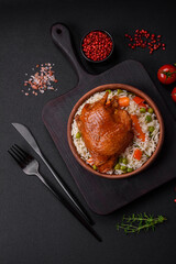 Delicious boiled rice with chicken and vegetables or risotto with salt, spices and herbs