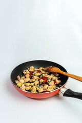 Seasoned Chicken Breast on a Frying Pan