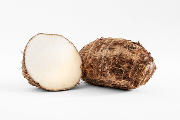 raw whole and cut taro or eddo tuber root
