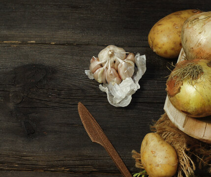 Fresh farm onion on wooden background