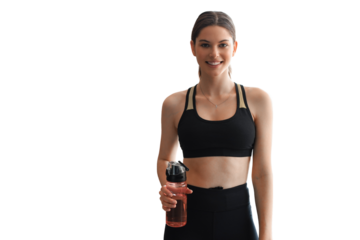 Young beautiful woman standing with dumbbell and drink water after exercising looking camera on a transparent background. Attractive female bodybuilder working out.