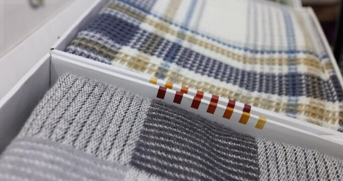 Samples of colorful fabrics in palette of textile catalog or warm blankets. Choice of different colors and textures