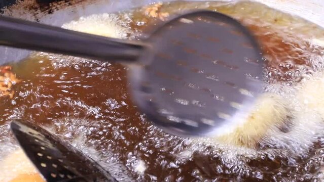 Closeup shoot of Traditional Bangladeshi street food Potato Chop fried on the pan 