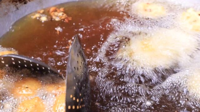 Closeup shoot of Traditional Bangladeshi street food Potato Chop fried on the pan 
