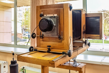 Huge old wooden camera for work in a photo studio and photo equipment.