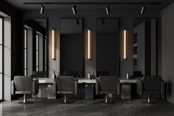 Grey modern barber shop with chairs in row and mirror, accessories on table