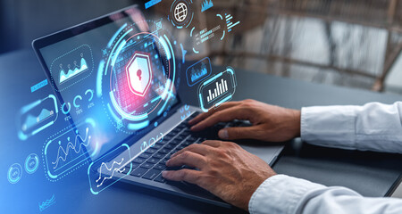 Man hands typing on laptop with cybersecurity interface