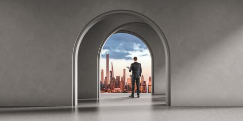 Businessman in office interior with mockup wall, New York city at golden hour