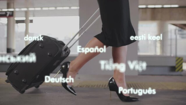 Cropped shot of businesswoman legs with suitcase walk in airport with holograms of different coutries. 