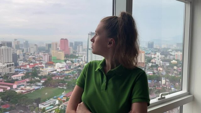 Modern Malaysian,Kuala Lumpur Capital City Cityscape Skyline with Tall Skyscrapers Buildings - Central Business District - woman Looking Through Windows on city
