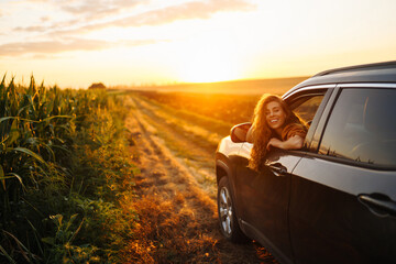 Relaxed happy woman on summer road trip travel in the car. Lifestyle, travel, tourism, nature,...